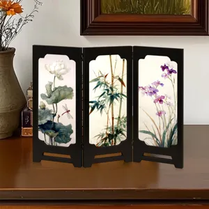 Detailed shot of the retro Chinese style folding screen ornament, showcasing exquisite botanical painting.