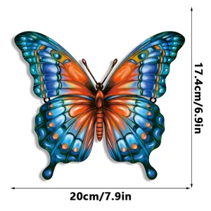 Metal butterfly wall art detail, blue and orange iron garden hanging decor, 20cm size.