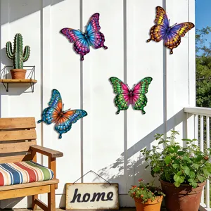 Colorful metal butterfly wall art detail showcasing vibrant gradient colors and design.