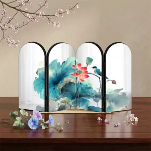 Close-up of decorative desktop folding screen with Chinese lotus art and acrylic mirror design.