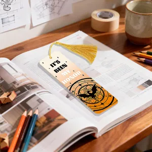 Creative mystical dragon design bookmark with yellow tassel, perfect for reading and book lovers.