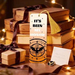 Detailed view of creative translucent acrylic bookmark with golden tassel and dragon art.
