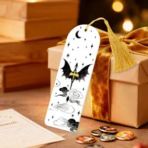 Detailed view of creative acrylic bookmark with dragon pattern and elegant golden tassel.