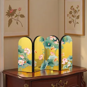 Detailed view of traditional Chinese style lotus folding screen ornament on wood table.