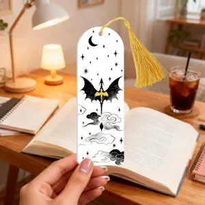 Acrylic fantasy dragon bookmark with gold tassel, translucent design for reading lovers.