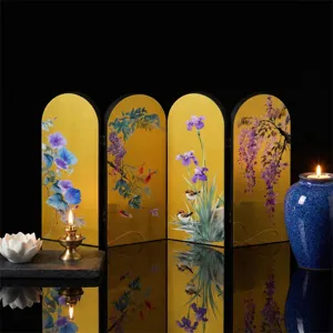 Exquisite Chinese style mini folding screen detail with gold background and floral motifs.