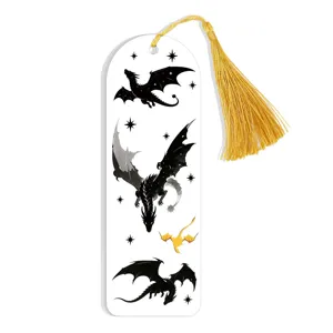 Detailed view of an acrylic bookmark featuring black dragon illustrations and a golden tassel.