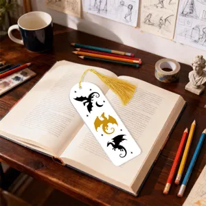 Creative dragon pattern bookmark with golden tassel for reading lovers and book decoration.