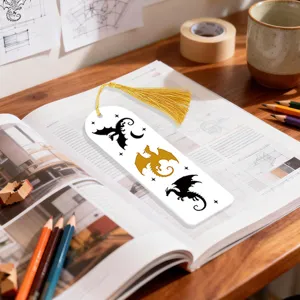 Creative dragon pattern acrylic bookmark with golden tassel for reading lovers and bookworm gifts.