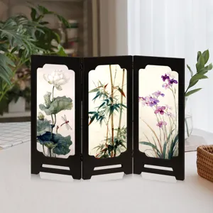 Mini desktop folding screen detail, traditional Chinese style lotus and bamboo artwork decor.