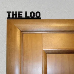 Black acrylic THE LOO letter decorative sign for home decor door sticker detail.