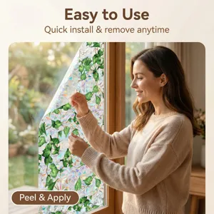 Detailed view of decorative static window film with vibrant green ivy leaf pattern for home decor.