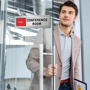 Conference room sliding door sign office status indicator plate in use door plaque detail view