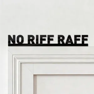 Black acrylic wall sticker featuring bold lettering, sleek detail view for home decor.