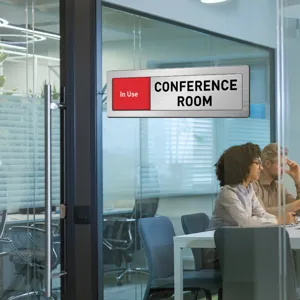 Office conference room sliding door sign with in use status indicator, metal brushed finish detail view.