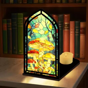 Fermalibri in vetro colorato fungo per libreria con cornice ad arco e luce calda.