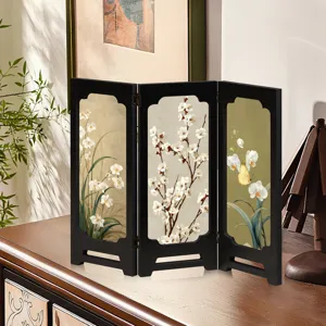 Detailed view of traditional Chinese mini folding screen desktop ornament with floral art design.