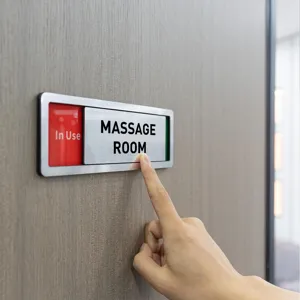 Sliding door status sign detail showing massage room indicator with adjustable red green display.