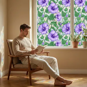 Scene detail showing purple floral static window film installed on a bright window.
