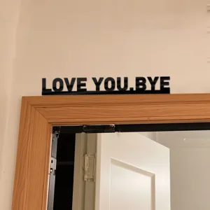 Black acrylic LOVE YOU BYE wall sticker, modern decorative sign for bedroom and living room.