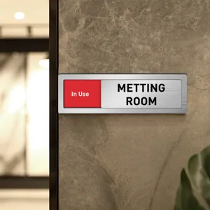 Sliding meeting room status door sign detail view, professional office sign with clear text.