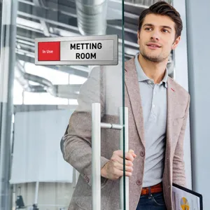 Detailed view of the office meeting room sliding door status sign indicator in use display.