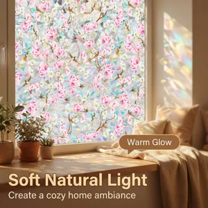 Decorative static window film with pink floral and bird pattern, warm natural light effect.