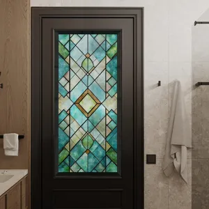 Detailed view of 3D stained glass window film applied on a dark door, geometric pattern design.