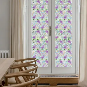 Static window film with purple floral pattern applied on glass door for home decor detail.
