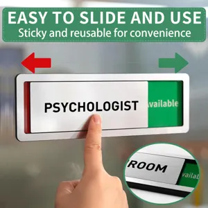 Detail view of sliding office door sign with green and red status indicator and metal frame.