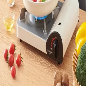 Estufa de gas portátil para cocina y exterior, quemador compacto con perilla de control.