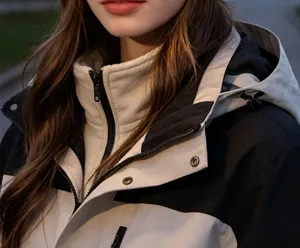 Details of the colorblock windbreaker jacket with cozy fleece inner collar for warmth.