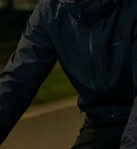Dark grey outdoor hooded jacket with zipper pockets, casual windbreaker for men and women.
