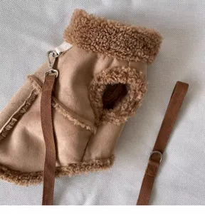 Warm pet winter vest with fleece lining and integrated leash for small dogs and cats.