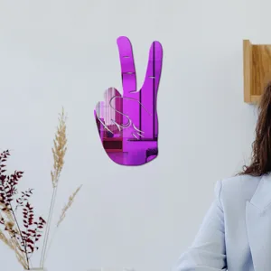 Detail view of purple acrylic peace sign wall sticker showing reflective surface and wall decor.