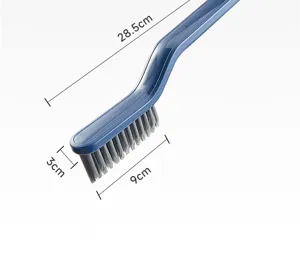 Close-up detail of blue plastic bathroom gap cleaning brush with stiff bristles!