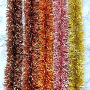 Detailed close-up view of colorful thickened tinsel garlands for holiday party decoration.
