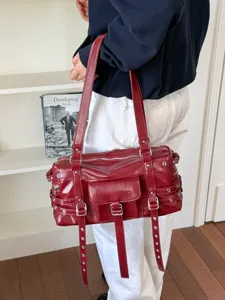 Stylish punk rivet motorcycle shoulder bag, trendy leather underarm handbag for women.