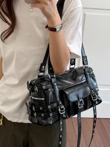 Punk style black PU leather motorcycle shoulder bag with rivets and metal buckles for women.