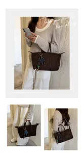Suede dumpling handbag for women, chic commuter shoulder and crossbody bag with charm.