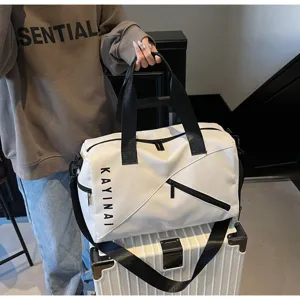 White gym duffel bag for women, waterproof travel shoulder bag with spacious compartments and pockets.