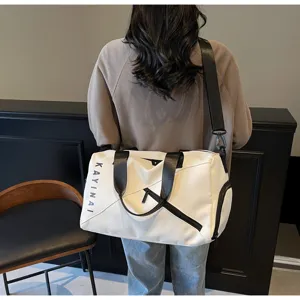 Stylish white travel duffel bag for women, large capacity fitness gym sports bag for training.