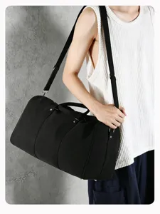 Large capacity black canvas travel duffel bag vintage boston handbag for fitness sports trips.