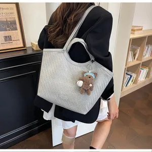 Fashion woven tote bag for women, stylish large capacity commuter shoulder bag for casual daily use.