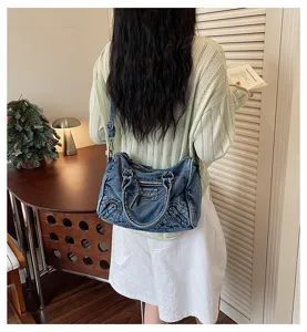 Vintage washed denim motorcycle bag for women, chic shoulder tote and stylish crossbody bag.