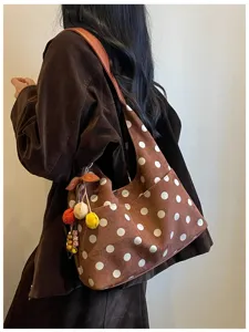 Detail view of the vintage brown suede polka dot tote bag, showcasing large capacity and stylish design.