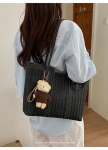 Chic black woven tote bag for women, stylish large capacity shoulder bag for daily commute.
