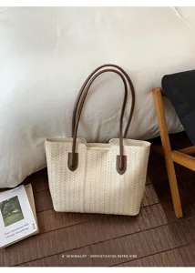 Detail shot of the woven tote bag showcasing textured material and brown leather handles.