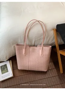 Pink woven leather tote bag detail, minimalist design shoulder handbag for women daily commuting.