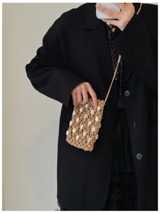 Borsa a tracolla mini con conchiglie intrecciate a mano borsa da telefono cava estiva per donna